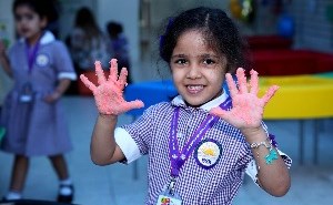 Girl showing messy hands